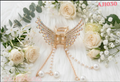 Gold Angel Wing Hair Clips – Detailed 3D Metallic Celestial Barrettes