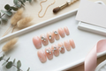 Luxury Press-On Nail Set – Nude Ombré Glitter with 3D Crystals & Silver Bow Accents